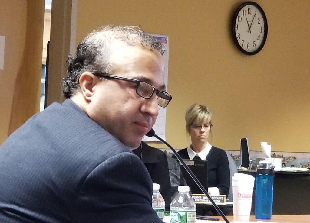 Alexander Pazoki, the director of the division of oral and maxillofacial surgery and dentistry at The Johns Hopkins Hospital in Baltimore, testified Saturday at a hearing into the professional skills of Lewiston oral surgeon Jan Kippax before the Maine Board of Dental Practice in Augusta. Behind him is Penny Vaillancourt, the board's executive director.