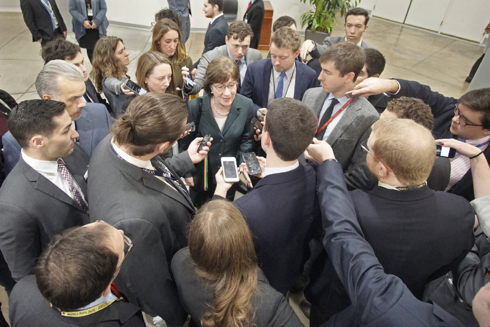 WASHINGTON, D.C. -
Sen. Susan Collins is surrounded by reporters while on her way to a vote in the Senate chamber on Dec. 12.