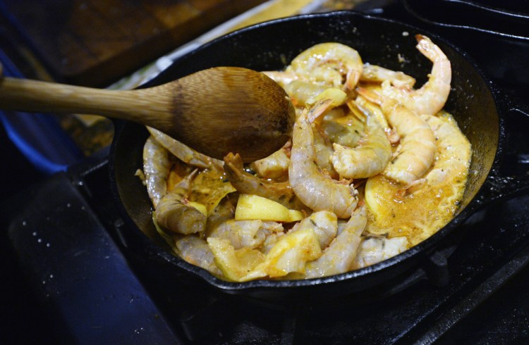 Louisiana BBQ shrimp with butter, garlic, lemon and three types of pepper.