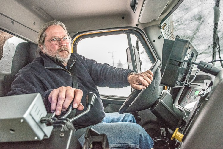 Jeff Ricker drives a plow truck for Lewiston Public Works on Monday, when over a foot of snow fell in the city.