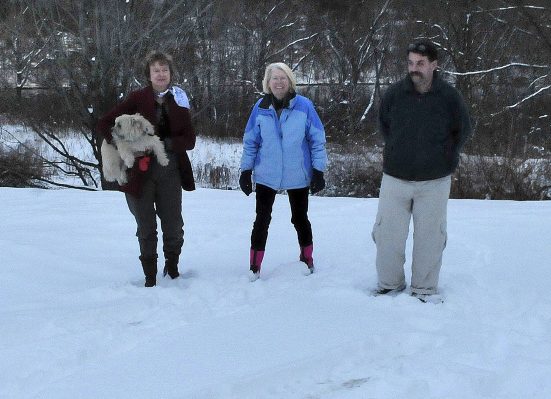 Waterville Community Land Trust members Nancy Williams, left, Ann Beverage and Scott McAdoo walk on one of two lots the land trust recently acquired, one of which will be used as a house lot, the other as green space with river frontage on Monday.