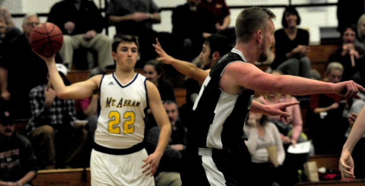 Mt. Abram's Nate Luce (22) looks to throw during game against Winthrop on Monday.