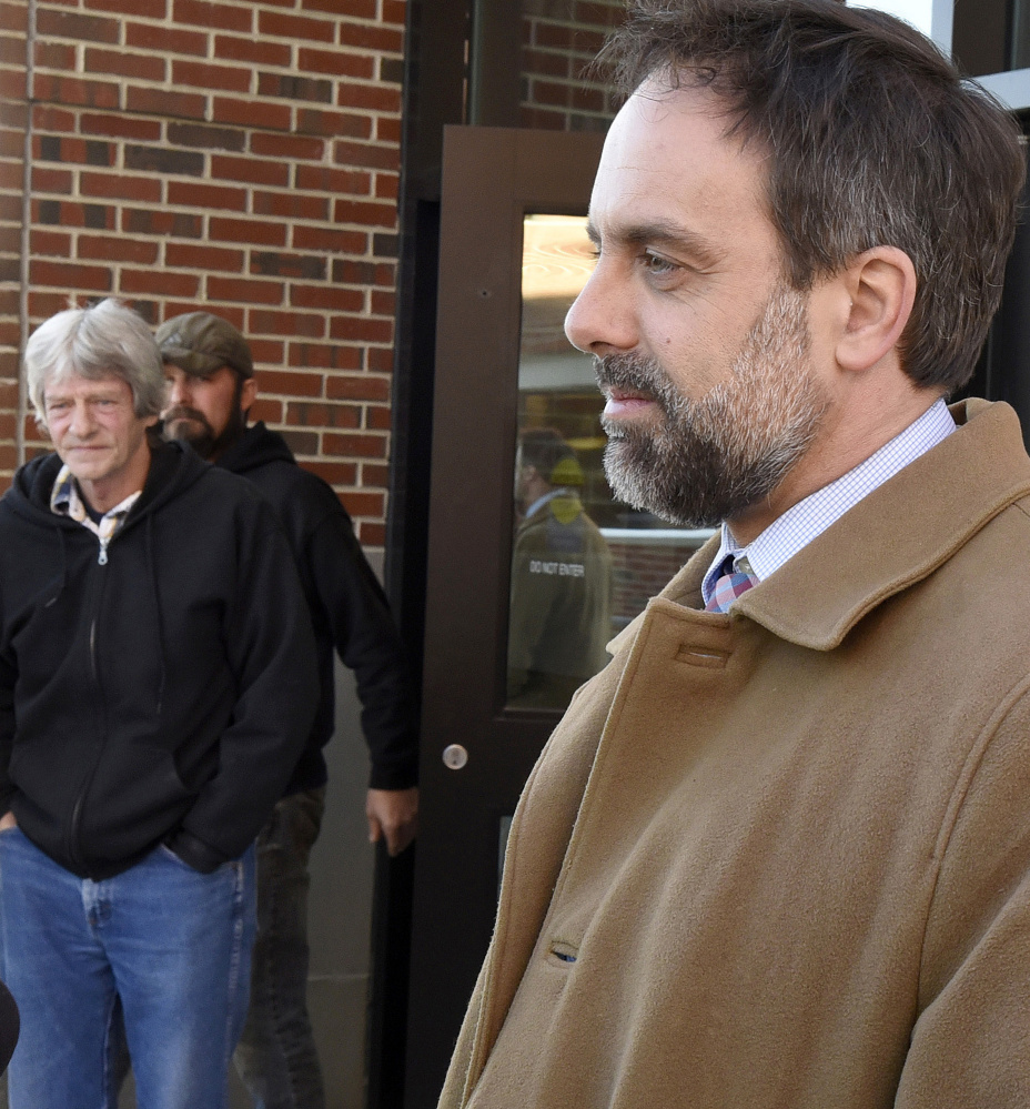 Vance Ginn, left, father of murder victim Stephanie Gebo, listens Friday as defense attorney Hunter Tzovarras comments on the sentence Robert Burton received at Penobscot Judicial Center. Burton was sentenced to serve 55 years in prison for the murder of  Stephanie Gebo. Ginn later spoke of the need to use ankle monitoring bracelets to prevent assaults and murders by people like Burton.