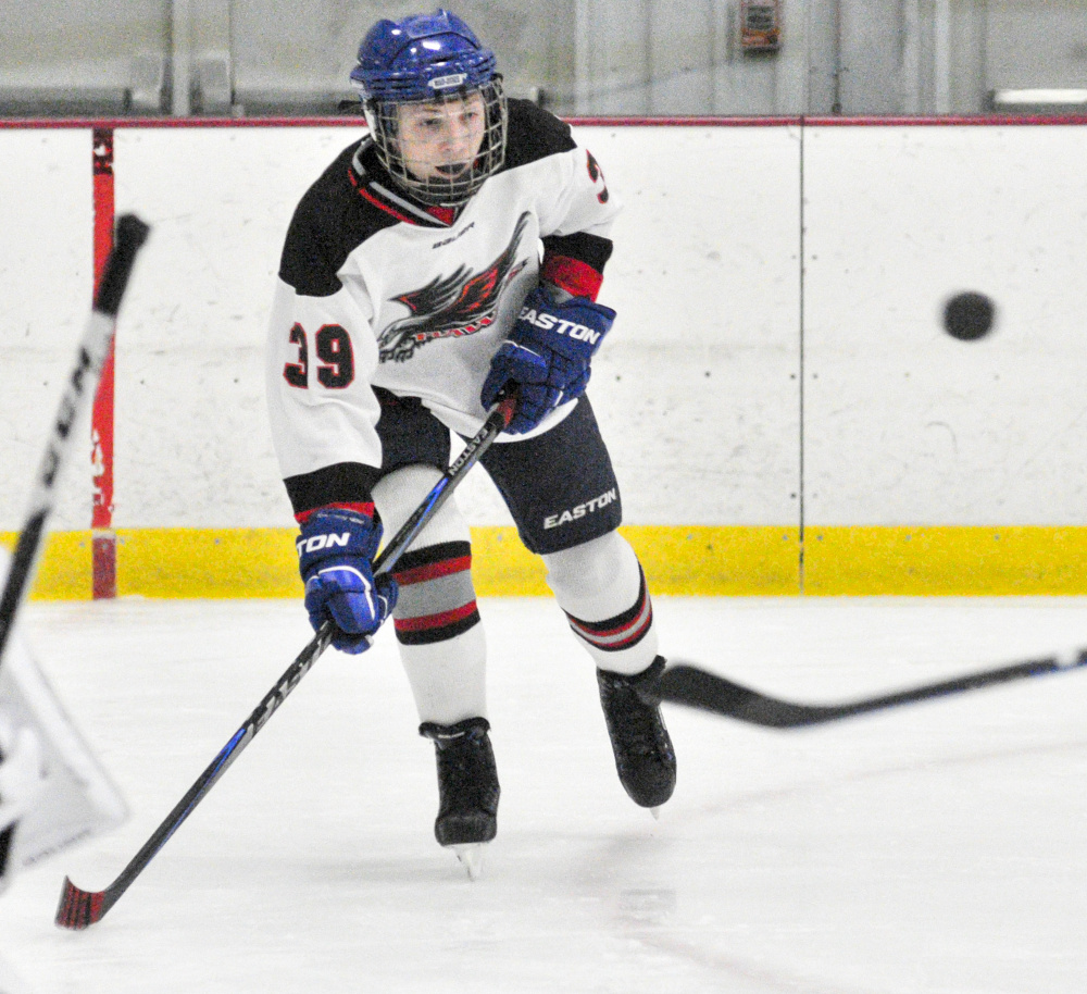 Maranacook/Winthrop defenseman Kyle Bean keeps an eye on a flying puck during a junior varsity game against St. Dominic in Bonnefond Ice Arena at Kents Hill School on Friday.