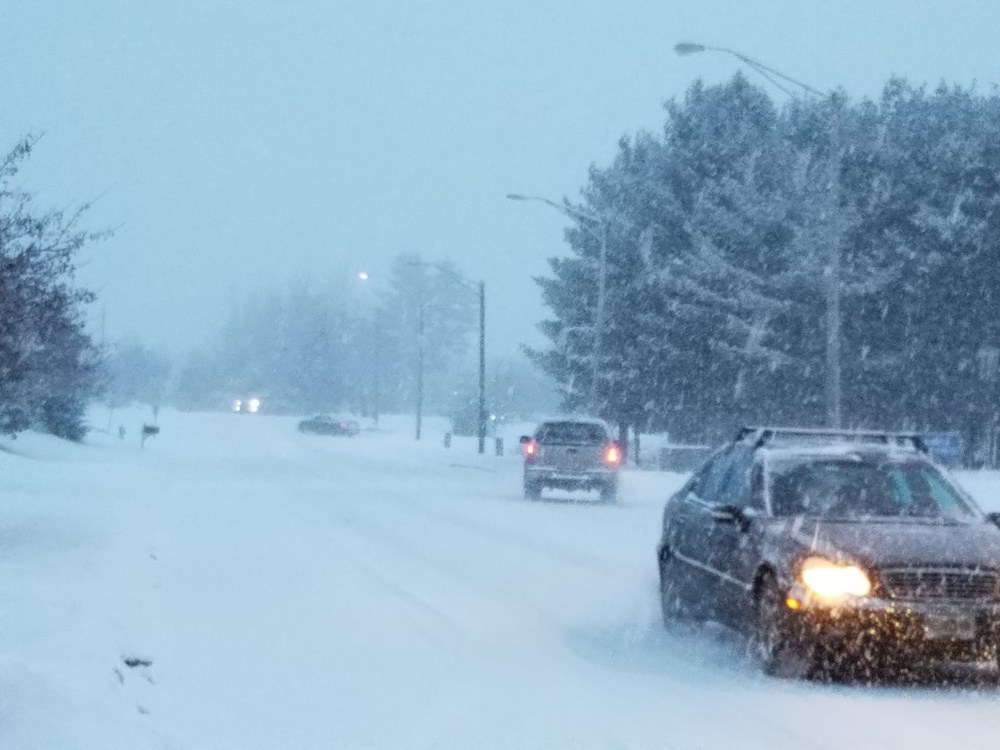 Drivers make their way down Anthony Avenue in Augusta as the first of a three-part dose of winter weather arrived Friday. Three to 5 inches of snow was expected, followed by freezing rain on Saturday and more snow on Christmas Day.