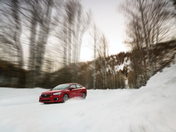 The 2018 Subaru Impreza Sport Sedan. The Impreza's steering is responsive. The suspension manages bumps and keeps the car stable in quick maneuvers. 