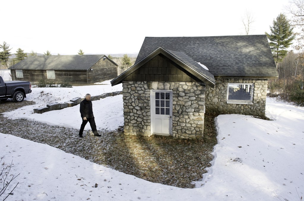 Summit Spring President Bryan Pullen walks into the Harrison spring house that was built in 1936. (Daryn Slover/Sun Journal)