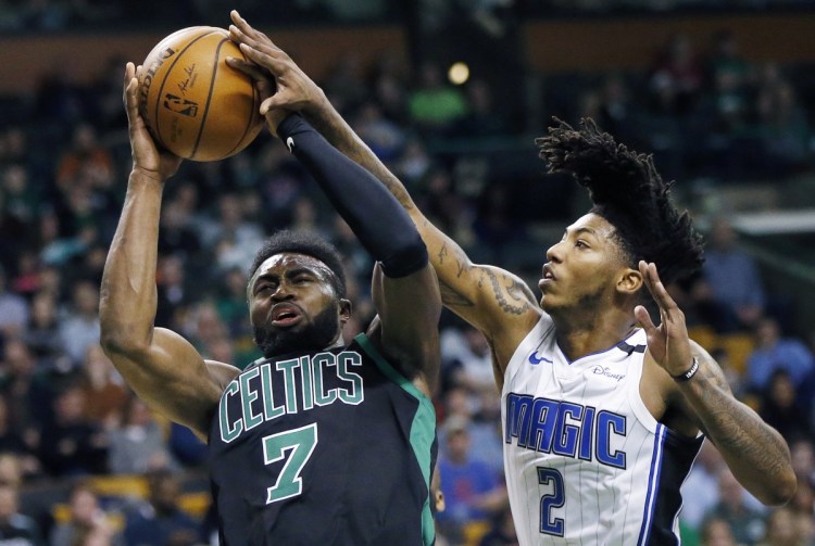 Boston's Jaylen Brown shoots while being defended by Orland's Elfrid Payton during the Celtics' 103-95 loss Sunday in Boston.