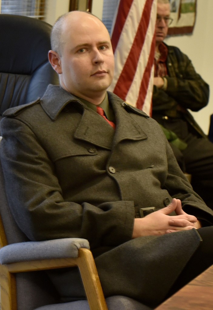 Tom Kawczynski listens during the meeting of the Jackman board of selectmen. He was fired Tuesday.