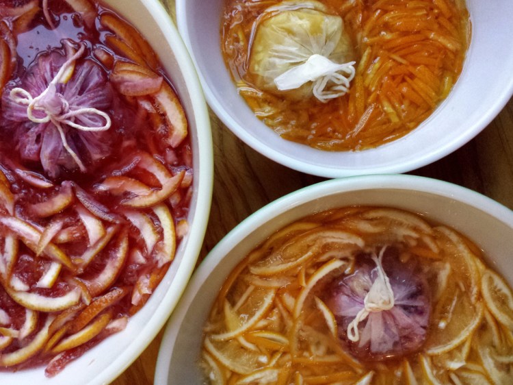 Macerating blood orange, kumquat and Meyer lemon peels.