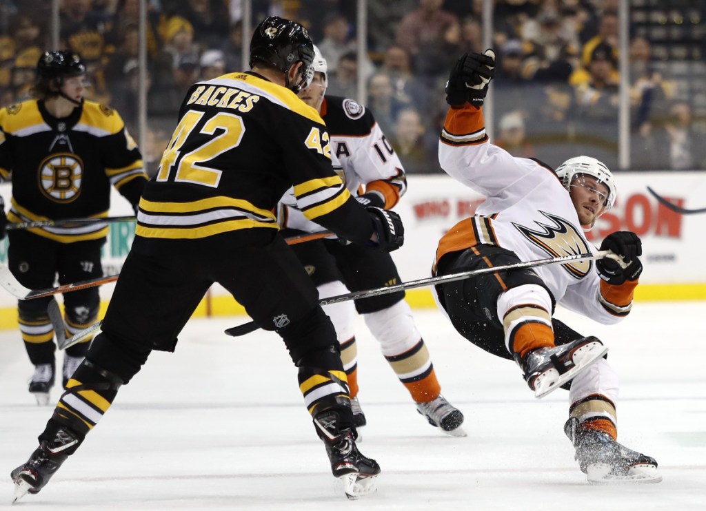 Boston's David Backes checks Anaheim's Chris Wagner during the third period of Anaheim's 3-1 win Tuesday in Boston.