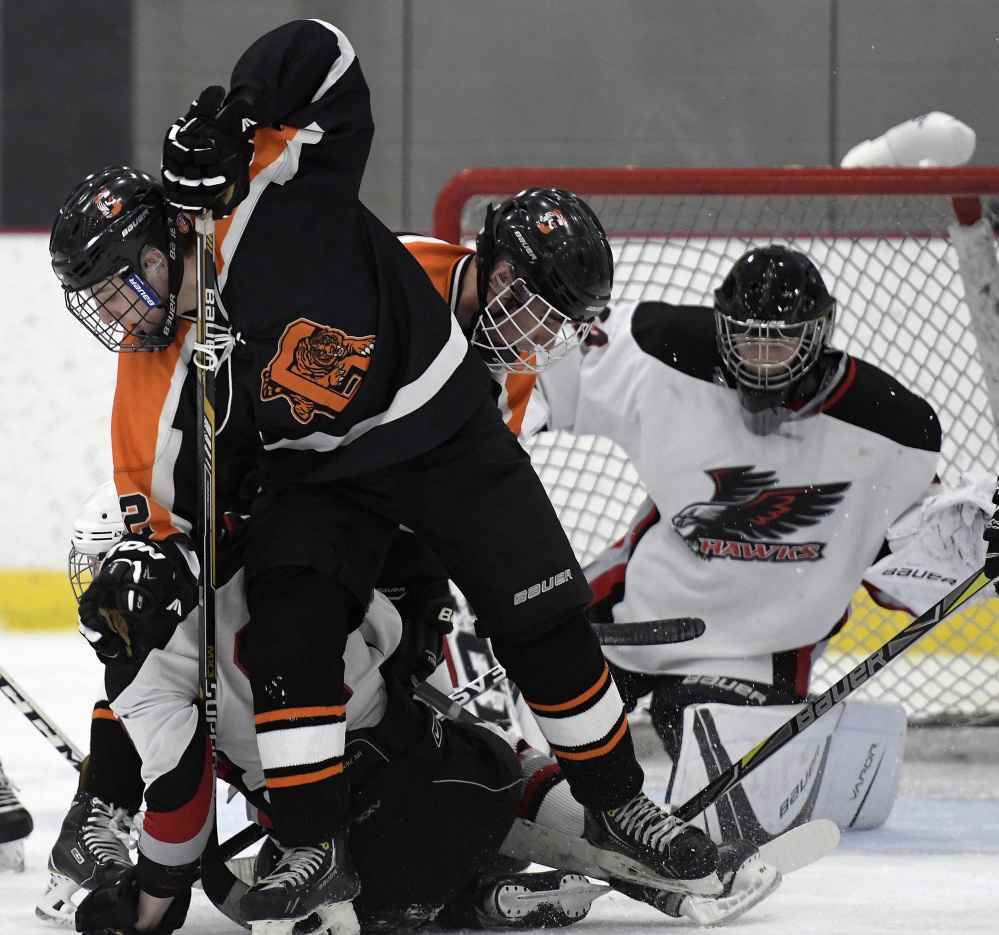 Action starts to heat up in front of the Maranacook/Winthrop/Madison's net as Gardiner looks to score during a game Monday night at Kents Hill.