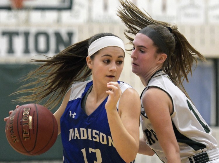 Winthrop's Jillian Schmelzer, right, guards Madison's Emily Edgerly during a Mountain Valley Conference game Tuesday in Winthrop.