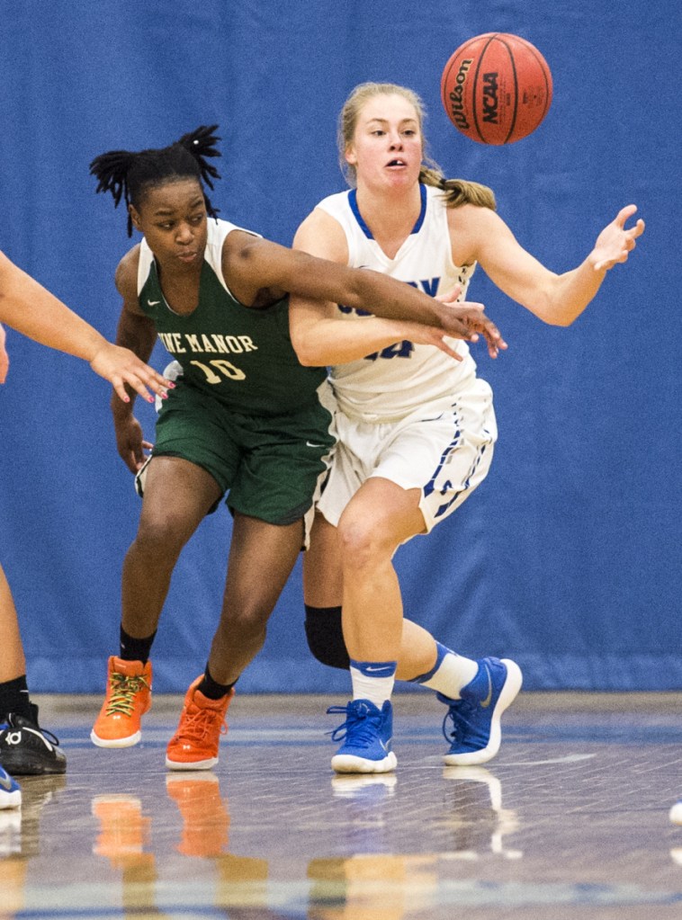 Colby College's Haley Driscoll, right, battles for the loose ball with Pine Manor College's Kayleigh Merrell (10) on Tuesday at Colby College in Waterville.