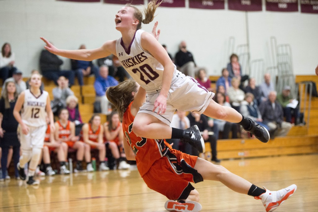 Maine Central Institute's Sydney Morton makes contact with Winslow defender Maeghan Bernard during a Kennebec Valley Athletic Conference Class B game last week