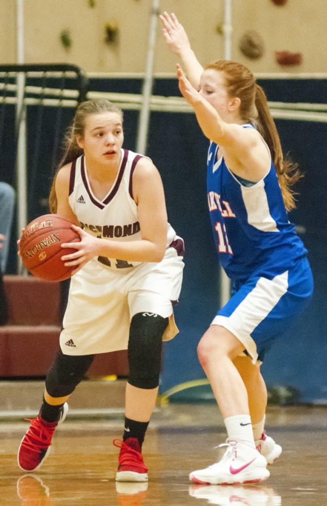 Richmond's Ashley Abbott, left, tries to pass around Oak Hill's Sadie Waterman during a Mountain Valley Conference game last season in Richmond. The Bobcats have found success since making the move from Class D to Class C.