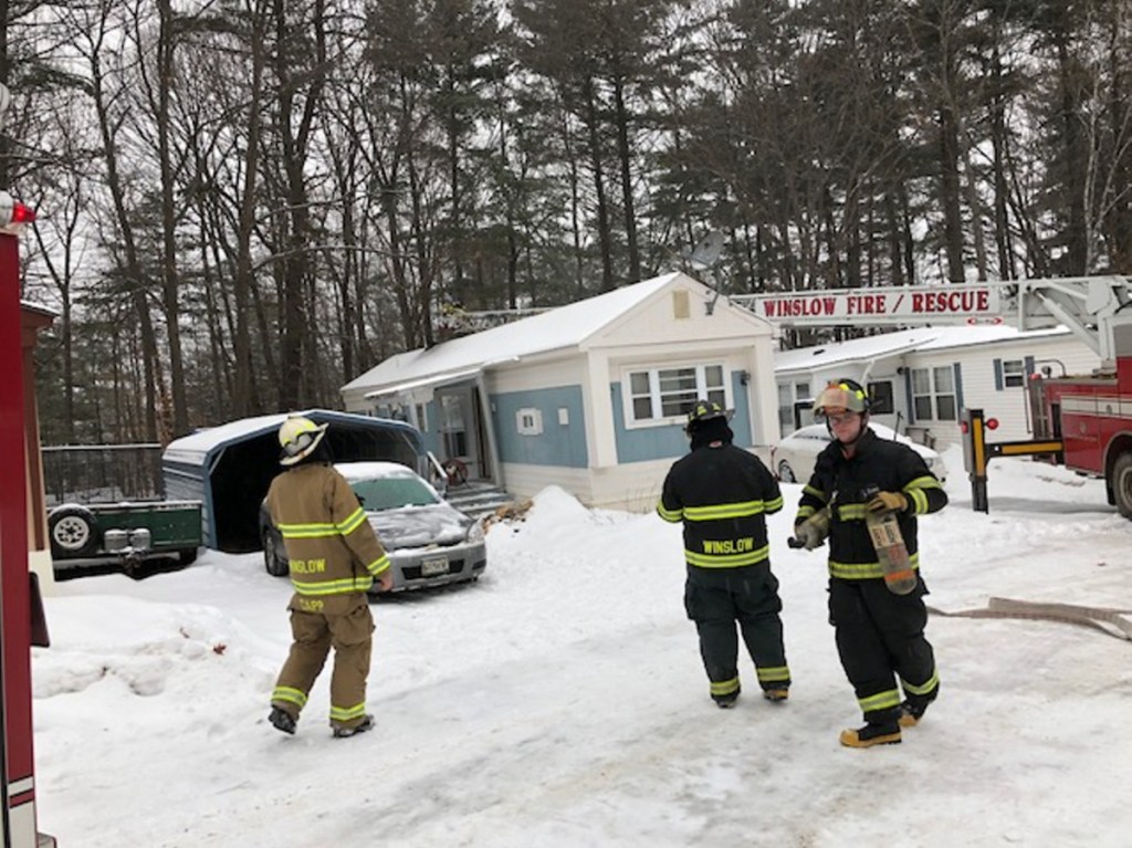 Winslow firefighters used a ladder truck Tuesday to reach the roof of a mobile home in the Pleasant Ridge Mobile Home Park on Benton Avenue in Winslow and remove a faulty smoke pipe that had started a smoky fire.