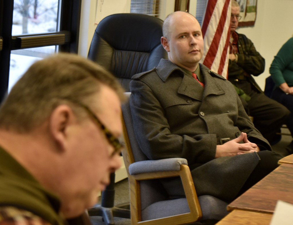 Jackman Town Manager Thomas Kawczynski, right, awaits action Tuesday by Selectman Alan Duplessis and other members of the Board of Selectmen. The board voted unanimously to fire Kawczynski as town manager at a meeting attended by about 50 residents.