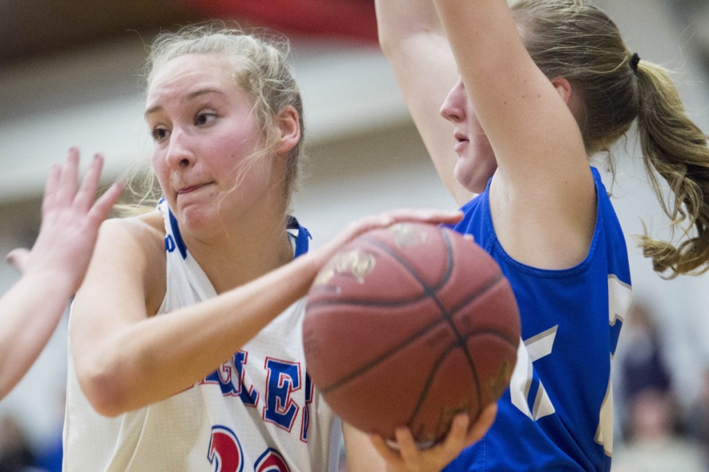 Messalonskee's Ally Turner, left, looks to pass as she is defended by Lawrence's Keagan Alley in a Class A North game Wednesday in Oakland.