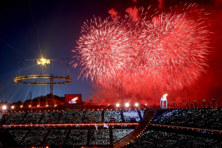 Fireworks go off after the Olympic flame was lit Friday during the opening ceremony of the 2018 Winter Olympics in Pyeongchang, South Korea.