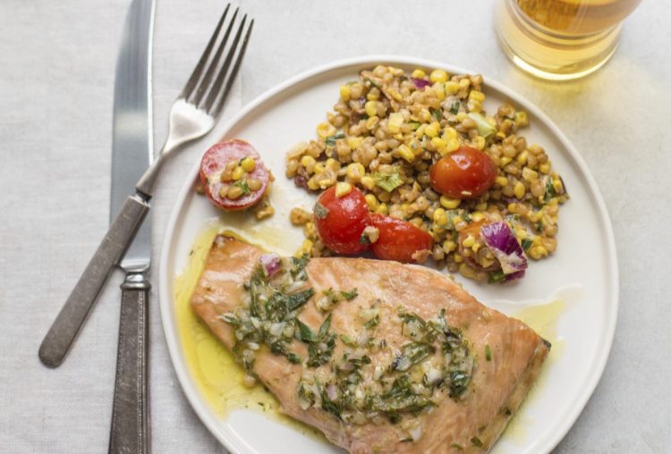 Salmon with a tarragon vinaigrette. Try starting the fish in a pan and later transferring it to the stove.