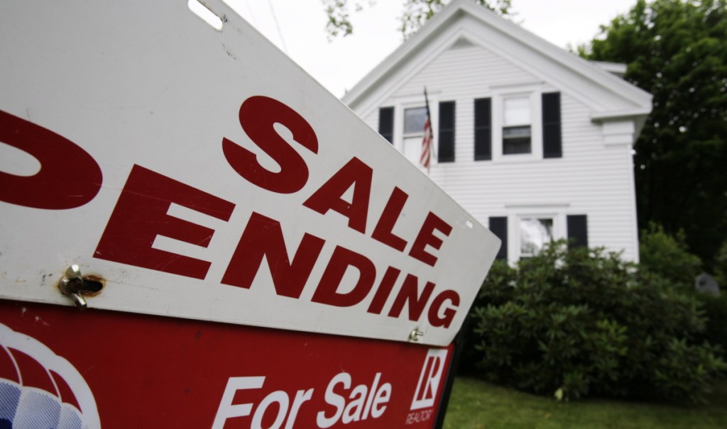 2011 AP FILE PHOTO 
 In this July 26, 2011 photo, a sale pending sign is set outside a house in Bath, Maine. The number of people who signed contracts to buy homes rose for a second month in June. But the gain was not enough to signal a rebound in the weak housing market.