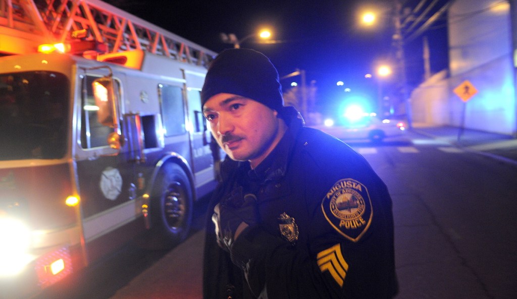 Augusta police Sgt. Vincente Morris looks down Arsenal Street in 2013 after a natural gas pipeline leak. Under a newly negotiatied set of labor contracts, Augusta police officers are getting a pay increase that will amount to about 20 percent by the end of the two-year contract period.