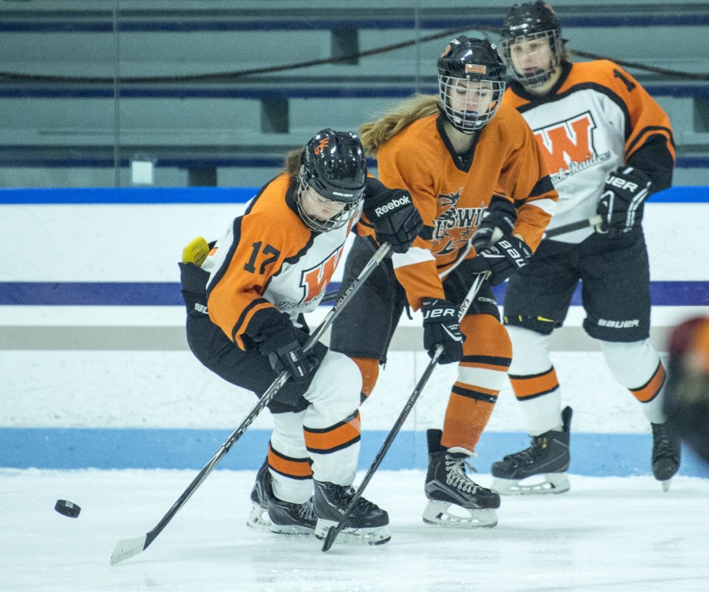 Winslow/Gardiner's Evelyn Hinkley takes control of the puck during an early December game against Brunswick at Colby College in Waterville.