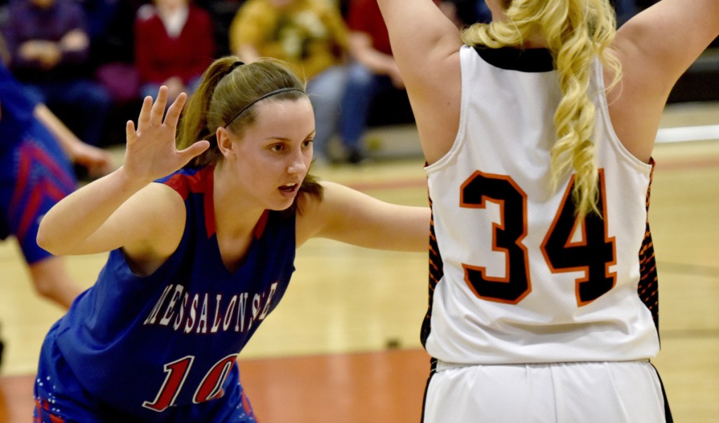 Skowhegan's Mariah Dunbar looks to make a pass as Messalonskee's Katie Seekins defends during a Kennebec Valley Athletic Conference Class A game Monday night in Skowhegan.