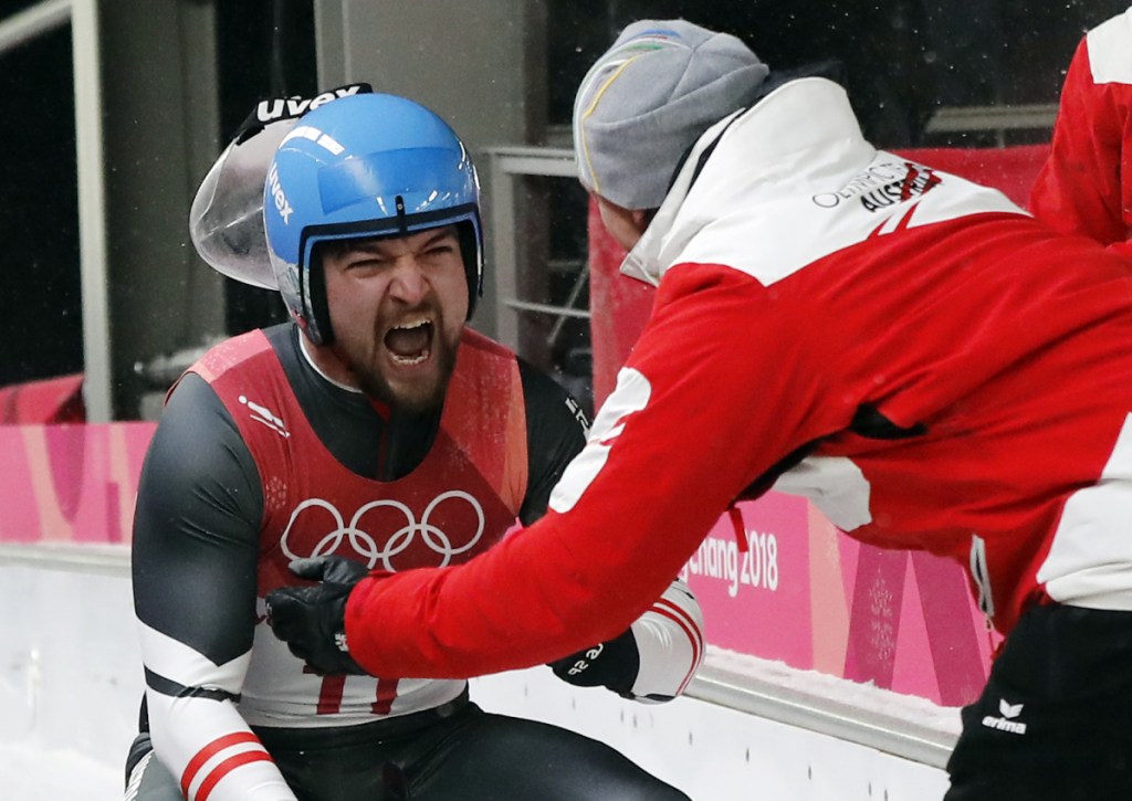 David Gleirscher of Austria celebrates his gold medal win during the final heats of the men's luge competition Sunday at the 2018 Winter Olympics in Pyeongchang, South Korea.