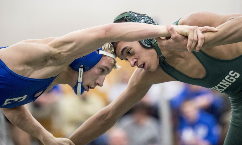 Erskine's Michael Sprague, left, wrestles Oxford Hills' Jaden David in a 126-pound match at the Class A North championships last Saturday at Oxford Hills.