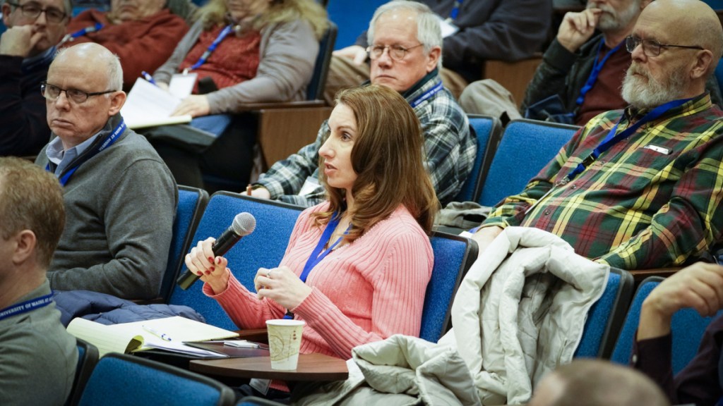 Kristin Logan, of Topsham and of the Midcoast Redevelopment Authority, asks a question about privacy Saturday during a drone business applications conference at the University of Maine at Augusta.