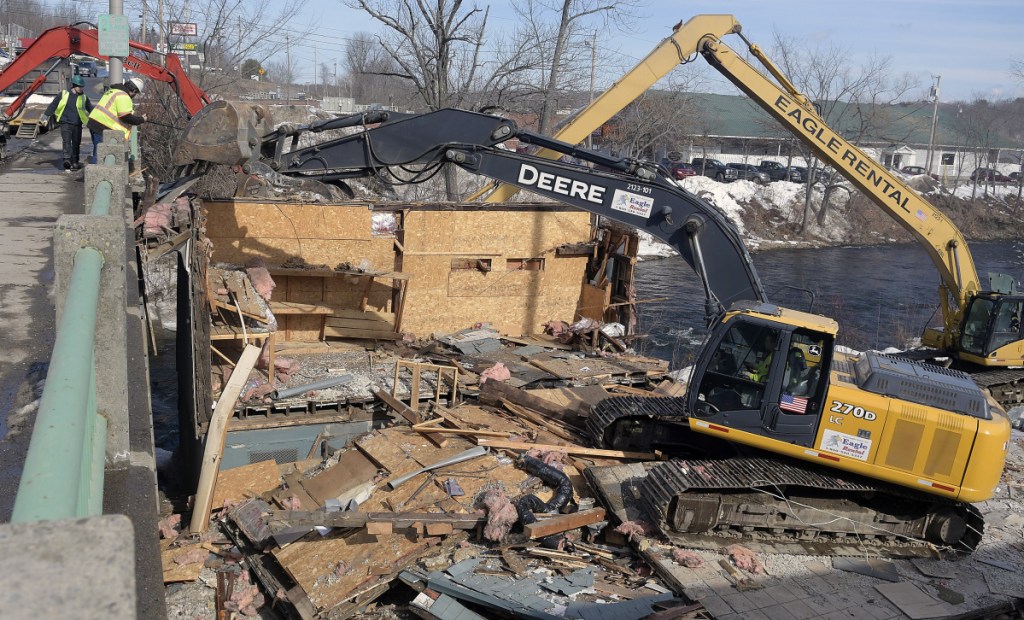 The former Dennis' Pizza is razed Monday in Gardiner.