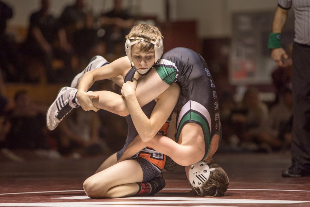 Skowhegan's Jake Craig gets a hold of Bonny Eagle's Colby Frost during the finals of the 106-pound division at the New England qualifier Saturday at Nokomis Regional High School in Newport.