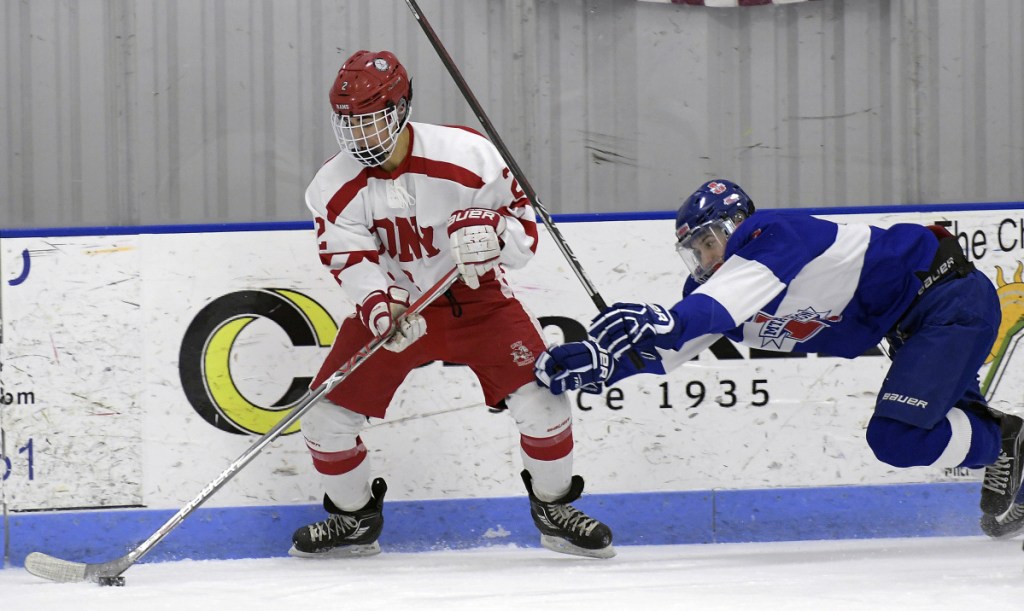 Cony/Monmouth/Hall_Dale seniorr Avery Pomerleau, left, breaks away from Lisbon/Mt. Ararat/Morse's Cam Poisson during a Class A North game earlier this season in Hallowell.