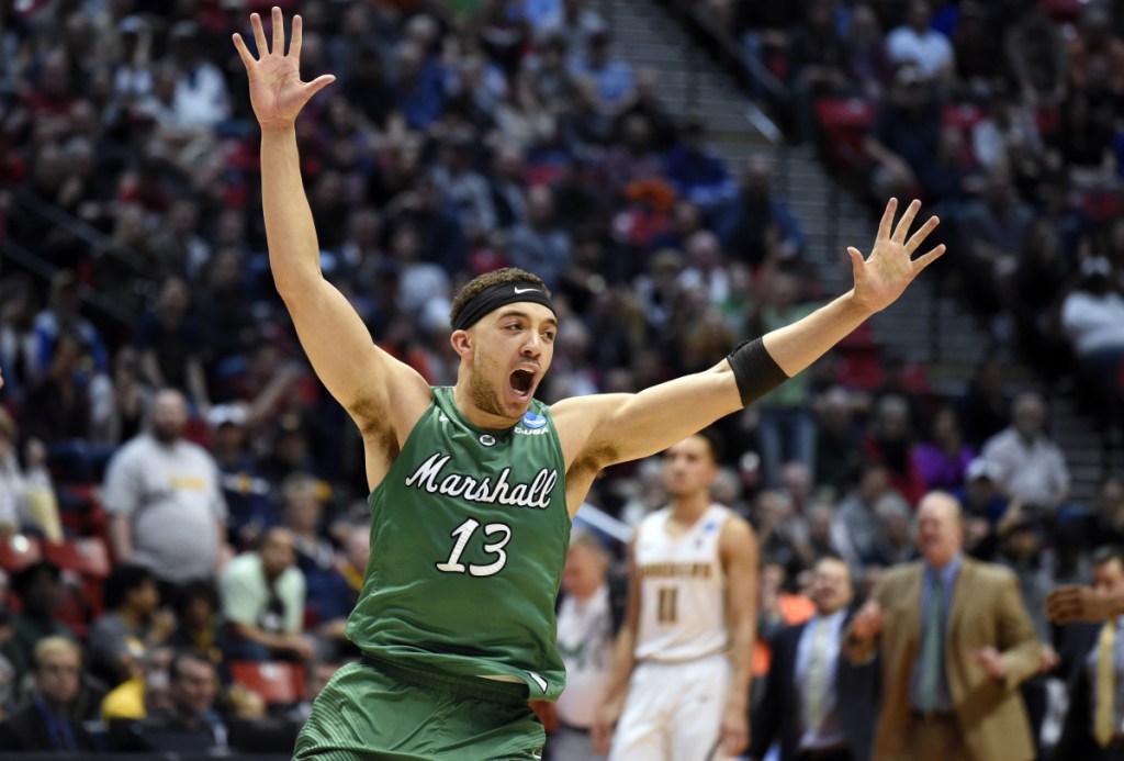 Marshall guard Jarrod West (13) reacts as time runs out in their first-round NCAA college basketball tournament game against Wichita State Friday, March 16, 2018, in San Diego. Marshall won 81-75. (AP Photo/Denis Poroy)