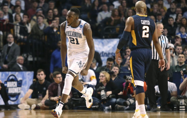 Villanova's Dhamir Cosby-Roundtree celebrates a dunk during his team's 90-78 win Friday night over West Virginia at the TD Garden in Boston. Villanova, the 2016 NCAA champion, will play Purdue or Texas Tech in the regional final on Sunday.