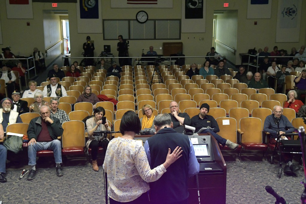 Togus VA employee Courtney Oliver, left, helps veteran Stanley Munson recite a poem the 2018 Maine Veterans Creative Arts Competition. Officials say the event is important because creative arts are vital to a veteran's care.