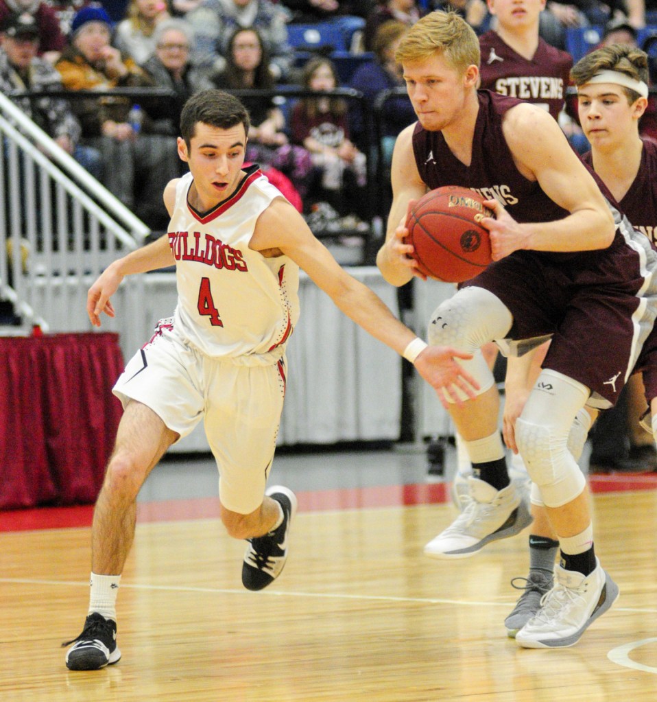Staff photo by Joe Phelan
Hall-Dale's Tyler Nadeau tries and misses on a steal from George Stevens Academy's Maxwell Mattson in the Class C state championship basketball game Saturday at the Augusta Civic Center.