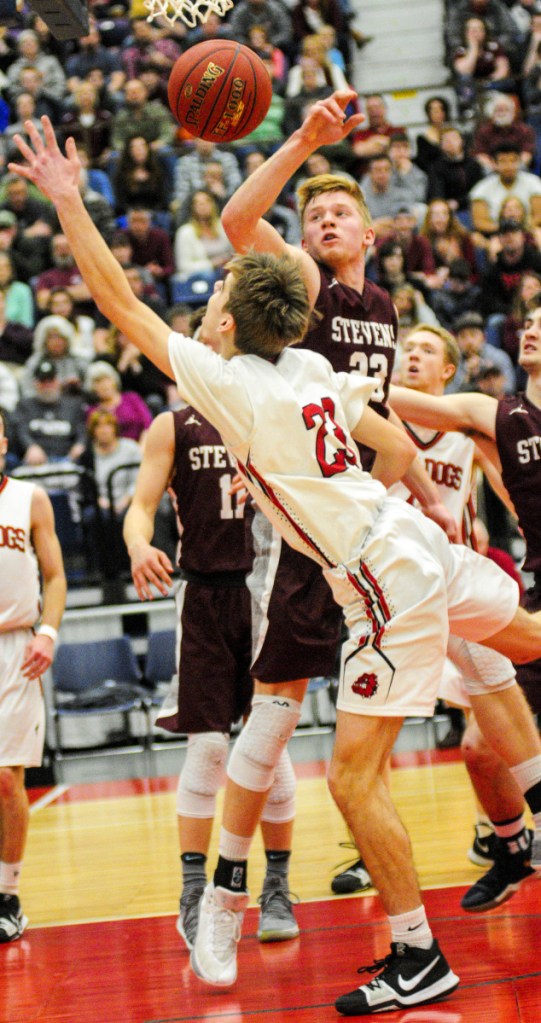 Staff photo by Joe Phelan
Hall-Dale's Ashtyn Abbott, bottom, and George Stevens Academy's Maxwell Mattson go for a rebound in the Class C state championship basketball game Saturday at the Augusta Civic Center.