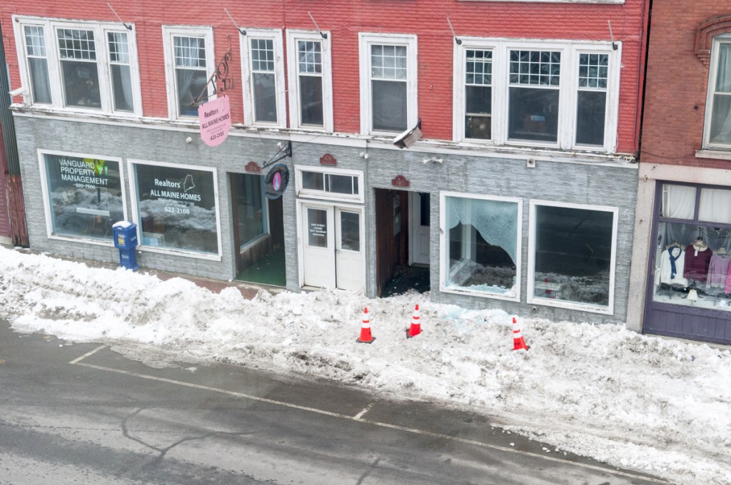 Damage to the window of unoccupied storefront at 106 Water St. is evident Thursday in downtown Hallowell. Earlier in the morning, a hit-and-run driver of a tractor-trailer failed to stop at intersection of Water and Winthrop streets, then struck a street light, which broke the window.