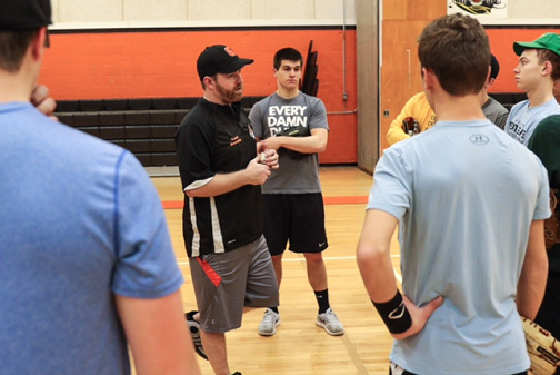 Gardiner baseball coach Russ Beckwith speaks with his pitchers and catchers during their first practice last season in Gardiner. Beckwith is the new baseball coach at Waterville.