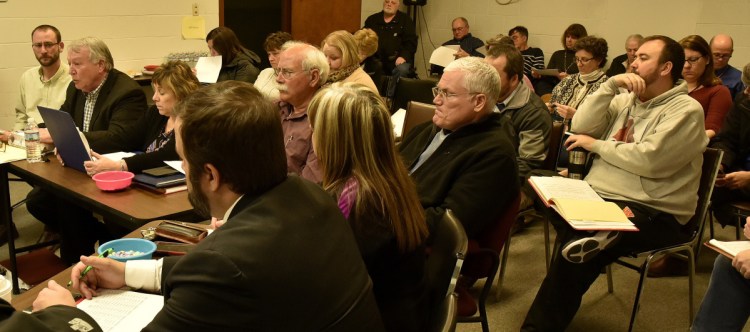 AOS 92 Superintendent Eric Haley, second from left, speaks Monday to the Winslow Town Council about the school system budget.