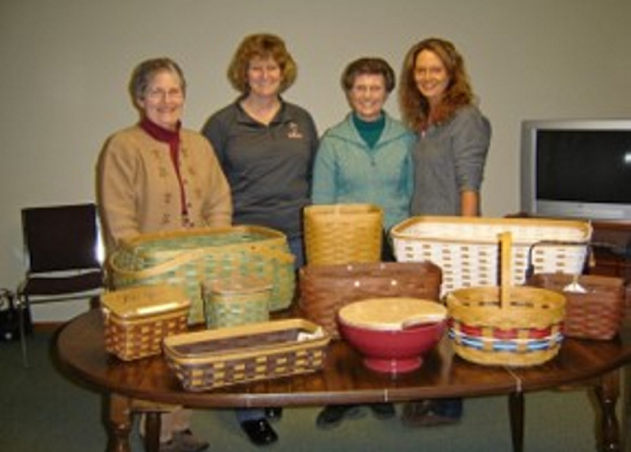 From left are Joan MacKenzie, Michaelyn Smith, Judy Johnson and Jill Mackenzie with basket that will be part of the basket bingo fundraiser set for March 30.