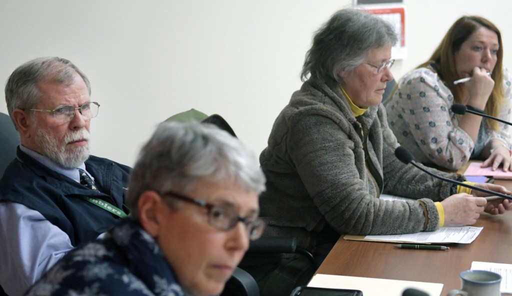 Winthrop school board members and Superintendent Gary Rosenthal listen Wednesday to people speaking during a board meeting about Rosenthal's tenure as superintendent.