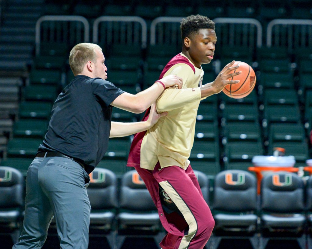 Keith Chesley, a Clinton native and former University of Maine at Augusta player, works with players during a recent Florida State men's basketball practice.