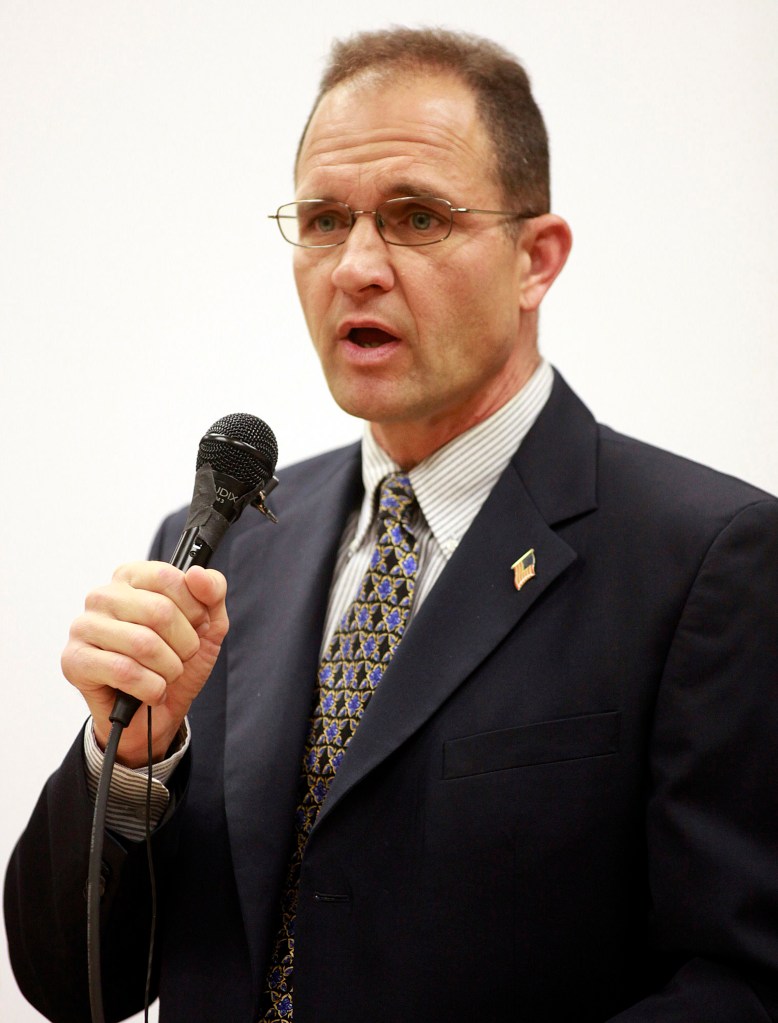 Seaside City Council member Dennis Alexander speaks on Oct. 4, 2010, during an election forum in Seaside, Calif. Alexander, a teacher in Northern California accidentally fired his gun in a classroom, injuring three students, police said. Alexander, who is also a reserve police officer, was pointing the gun at the ceiling to make sure it was not loaded when the weapon discharged Tuesday, March 13, inside his classroom at Seaside High School, KSBW-TV reported. The Seaside Police Department said no one suffered "serious injuries."