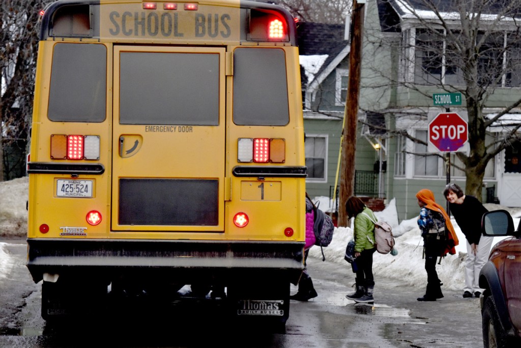 Albert Hall Elementary School Principal Barbara Jordan says goodbye to students boarding a bus in Waterville on Thursday. On Feb. 7, police received a report of a registered sex offender walking near the Hall School at the corner of Pleasant and School streets and arrested him on a charge of probation violation, according to police records. Waterville resident Andrew Ayers has asked the City Council to consider an ordinance prohibiting certain sex offenders from being within 750 feet of schools, parks and other places children under 14 frequent.