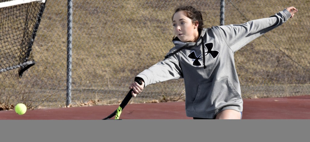 Erskine Academy's Anne-Marie Allen returns a shot during practice Wednesday in South China.