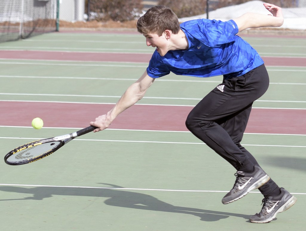 Maranacook's Rob McKee returns a serve during practice Tuesday in Readfield.